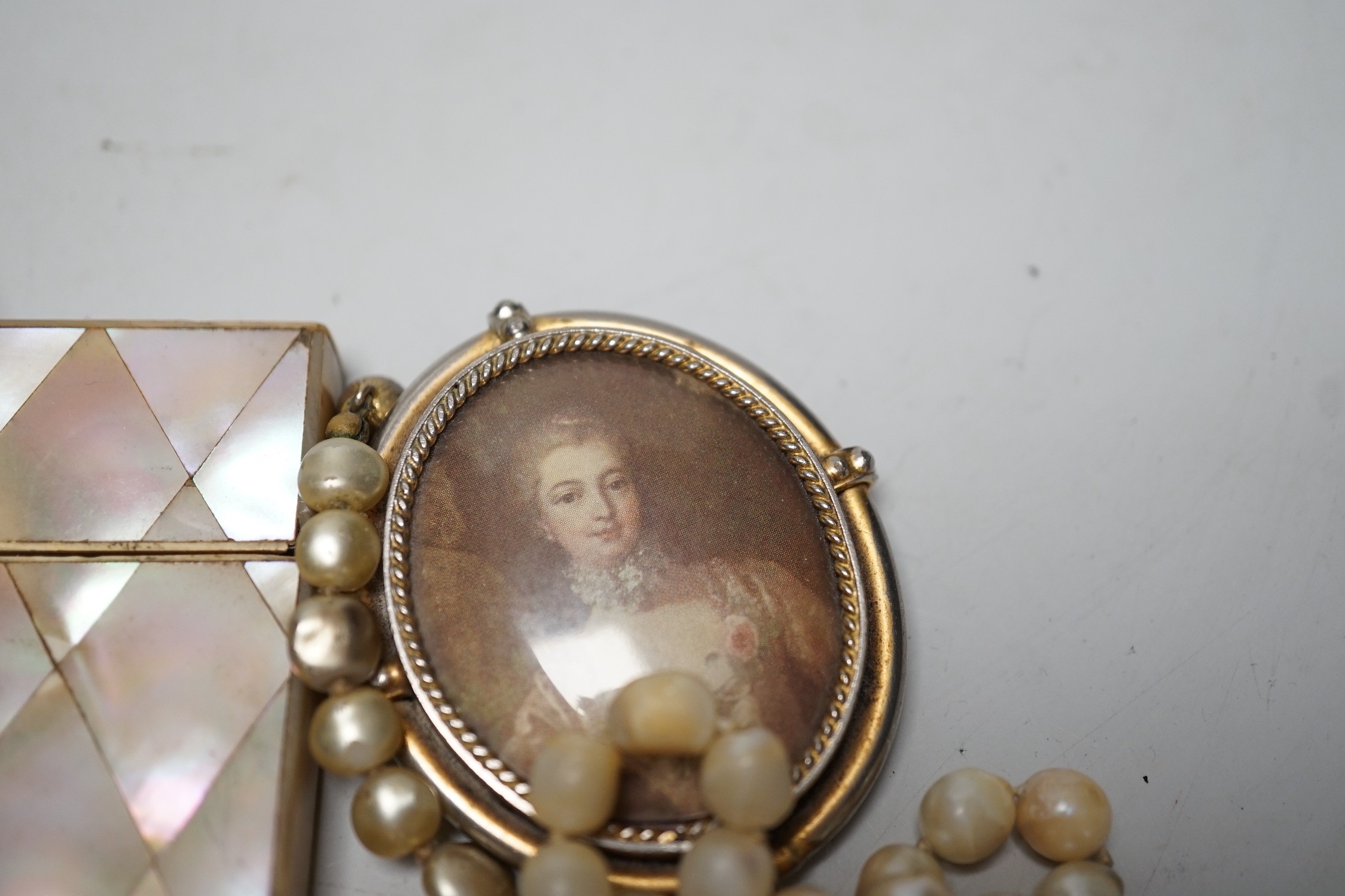 A collection of Victorian and later costume jewellery and a mother of pearl card case.